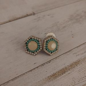 Gold turquoise and white gemstone stud earrings.